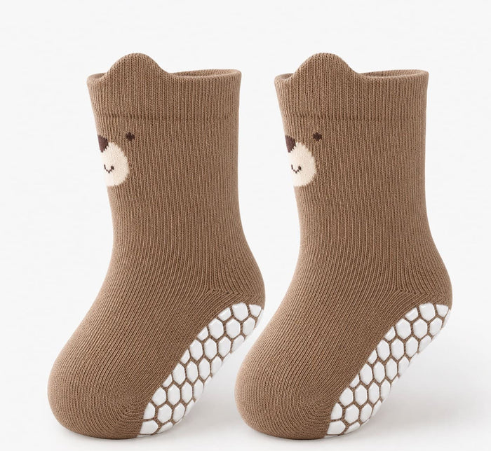 Pair of brown non-slip grip socks for toddlers