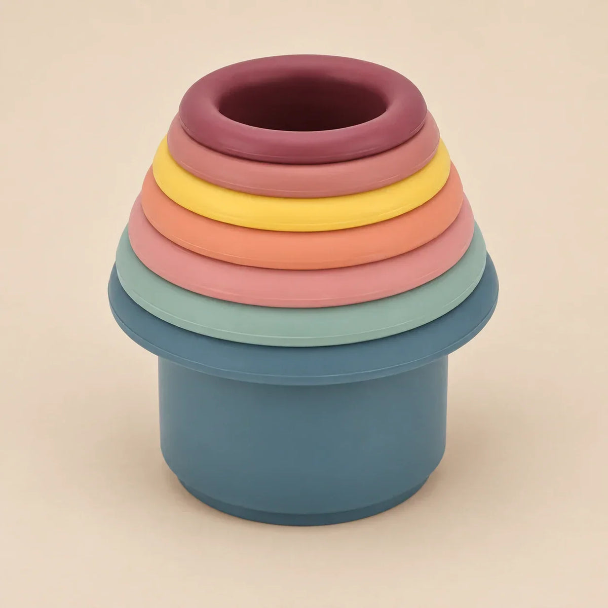 Set of soft silicone stacking cups in muted colors