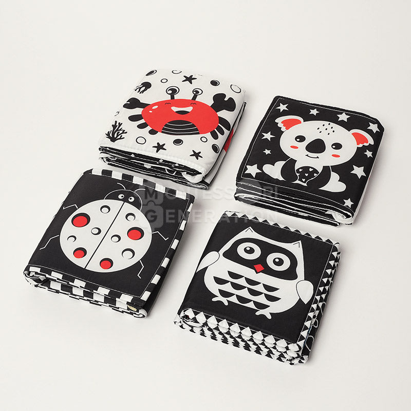 Crab, Ladybug, Koala, and Owl versions of the Montessori Newborn Contrast Book. 